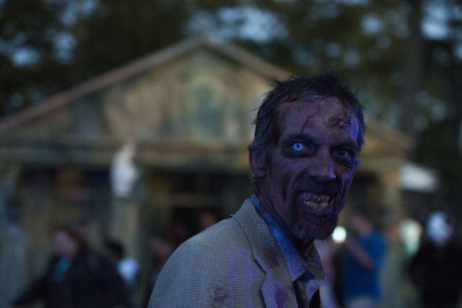 Haunted house workers scare festival attendees on Sunday, Oct. 29, 2017, at Voodoo Fest.