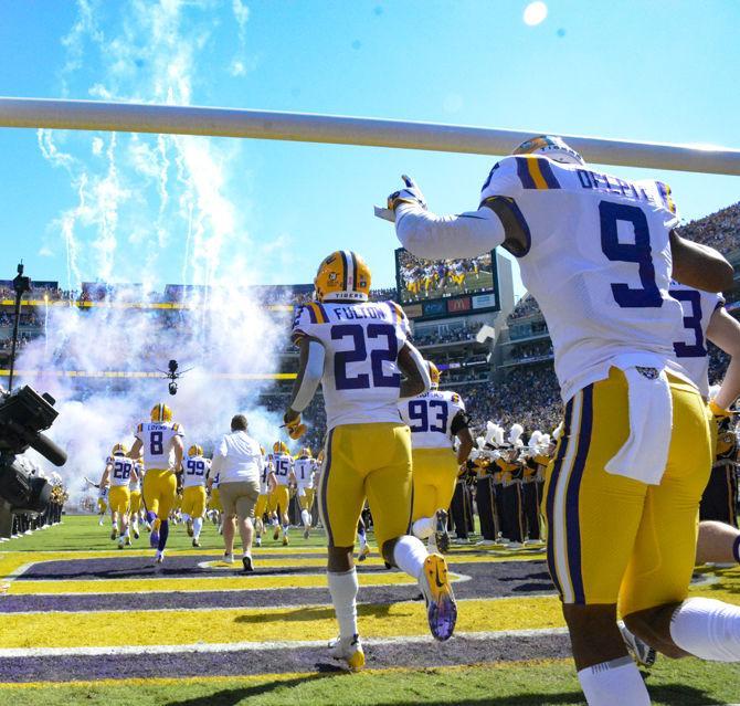 LSU football run onto the filed before LSU's 36-16 win against Georgia on Saturday, Oct. 13, 2018, at Tiger Stadium