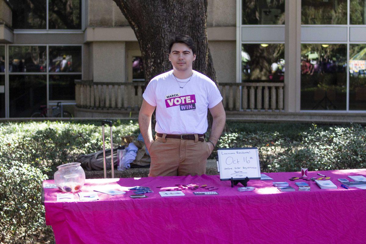 LSU mass communication senior Jack Stallard works at a table in Free Speech Alley on Friday, Oct. 12, 2018.