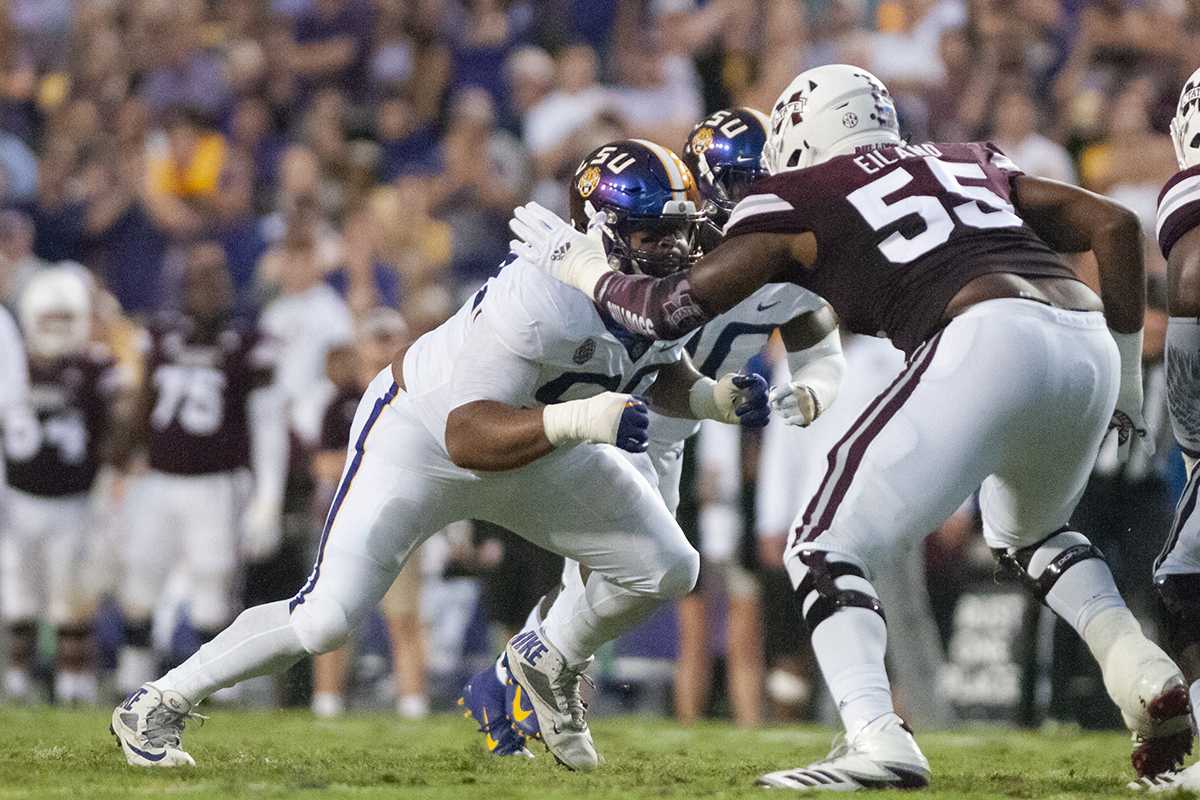 LSU junior defensive end Rashard Lawrence (90) blocks during the Tigers' 19-3 victory against Mississippi State on Oct. 20 at Tiger Stadium.