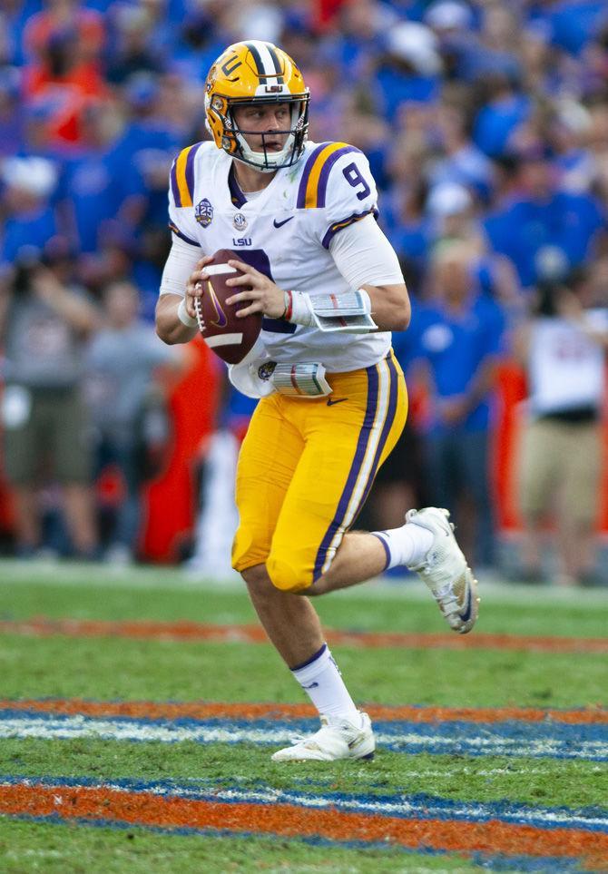 LSU junior quarterback Joe Burrow (9) scans the field during the Tigers&#8217; 27-19 loss against the University of Florida on Saturday, Sept. 2018 in Ben Hill Griffin Stadium.