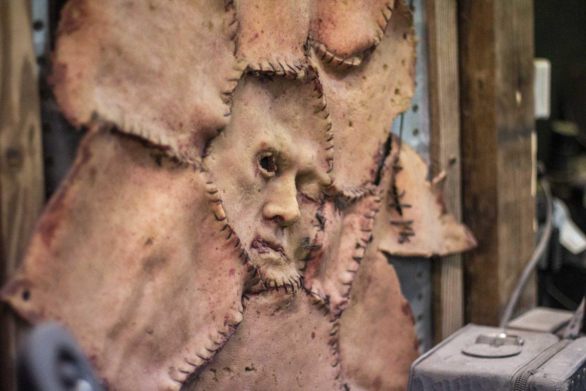 A mask prop sits attached to a chair backstage at the 13th Gate Haunted House on Friday, September 28, 2018.