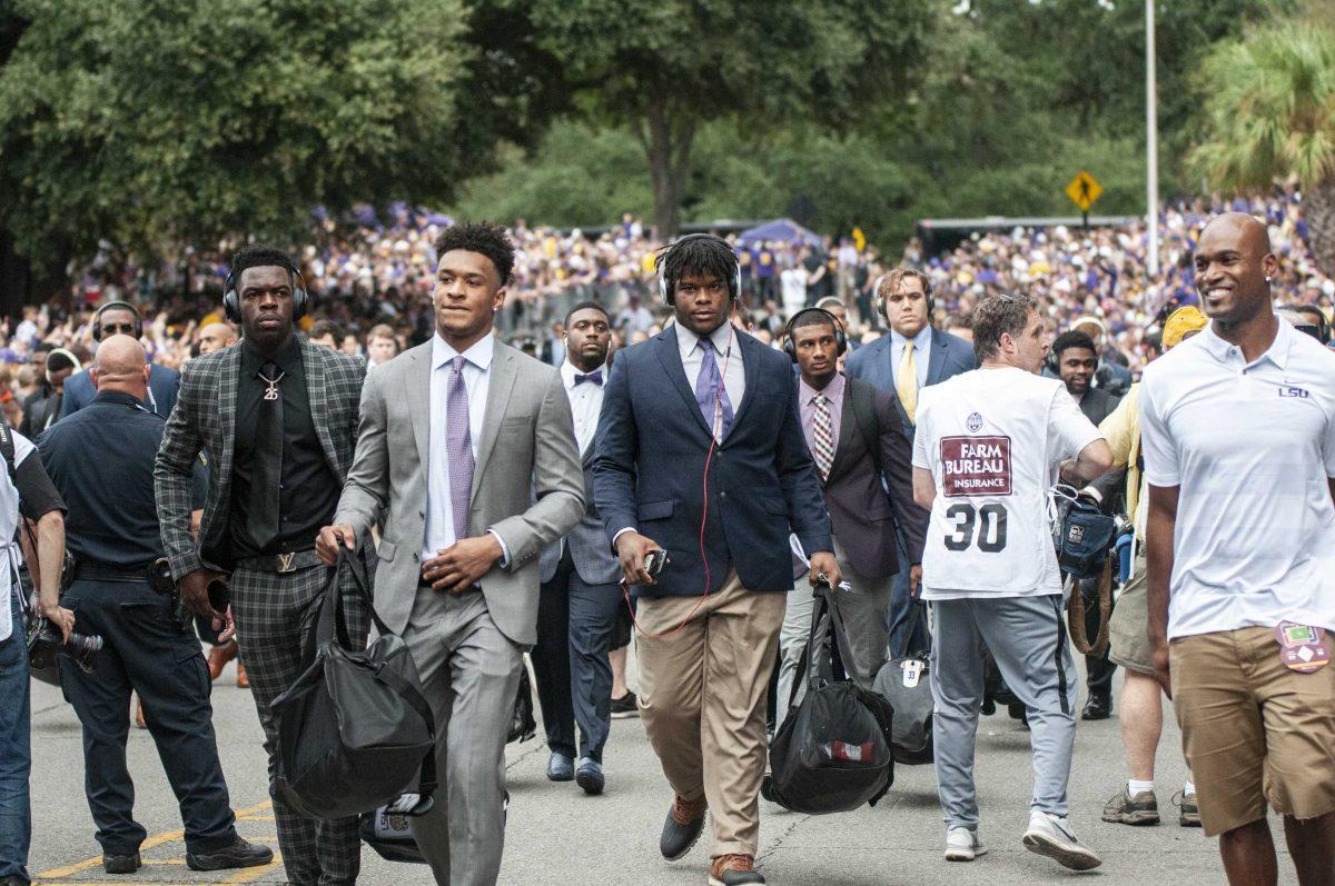 LSU football players march down Victory Hill before the game against Mississippi State on Saturday, Oct. 20, 2018.