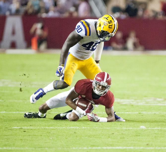 LSU sophomore linebacker Devin White (40) takes down Alabama freshman wide receiver Devonta Smith (6) during the Tigers' 10-24 loss to the University of Alabama on Saturday, Nov. 4, 2017, in Bryant&#8211;Denny Stadium in Tuscaloosa.