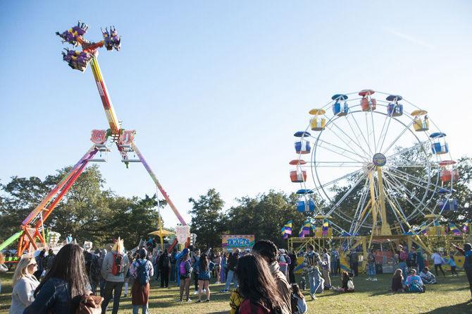 Carnival rides sit on the festival grounds on Sunday, Oct. 29, 2017, at Voodoo Fest.