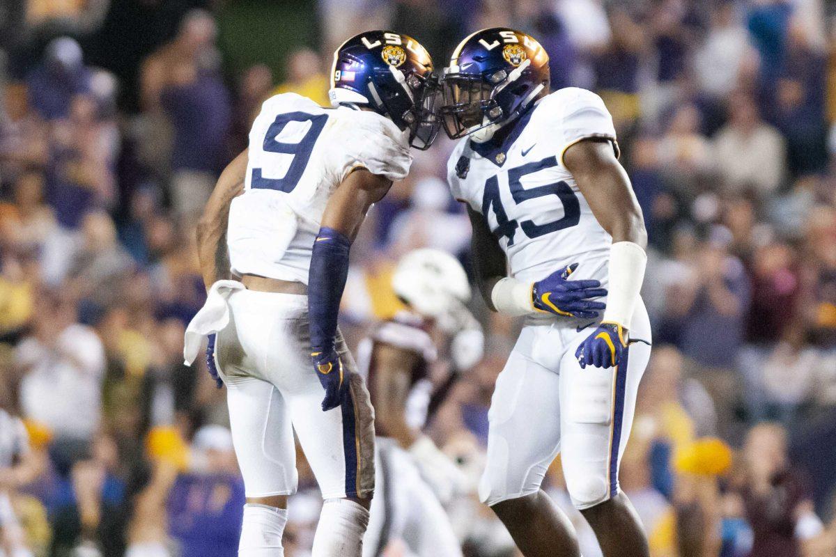 LSU sophomore safety Grant Delpit (9) LSU junior linebacker Michael Divinity Jr. (45) celebrate during the Tigers&#8217; 19-3 victory over Mississippi State on Saturday, Oct. 20, 2018, in Tiger Stadium.