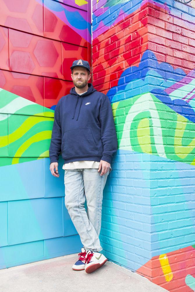 Marc Fresh poses in front of his work at the Baton Rouge Center for Visual and Performing Arts on Saturday, Nov. 10, 2018.