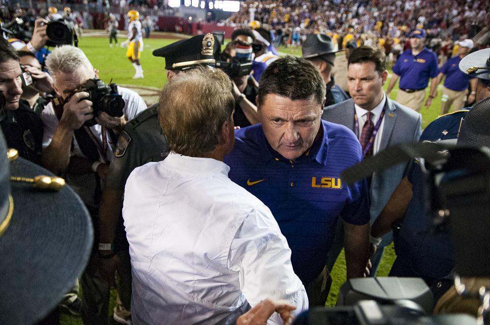 LSU head football coach Ed Orgeron meets with Alabama head football coach Nick Saban at centerfield after the Tigers' 24-10 loss against Alabama on Nov. 4, 2017, at Bryant-Denny Stadium.