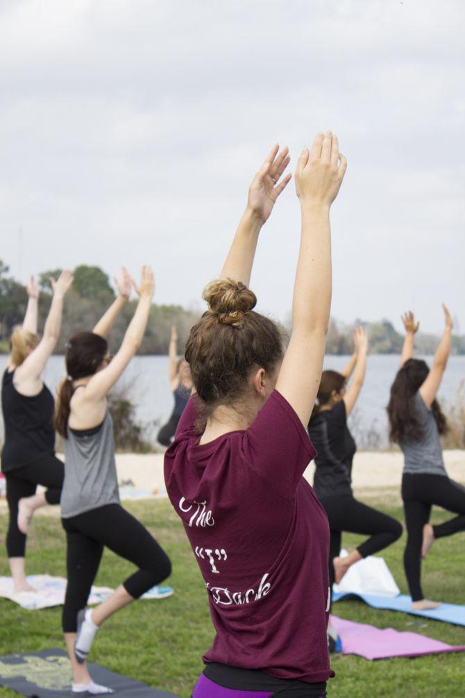 A participant practices yoga techniques in Milford Wampold Memorial Park in Baton Rouge on Sunday, Feb. 18, 2018.