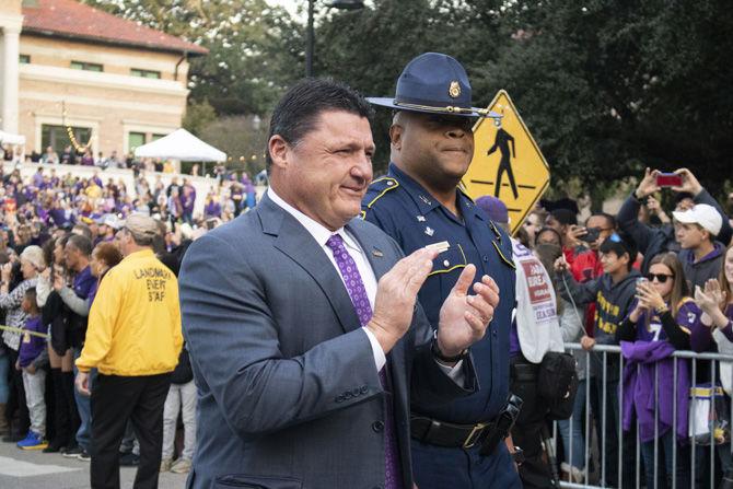 On Saturday, November 17, 2018 Coach O cheers with fans as he leads his team down Victory Hill.