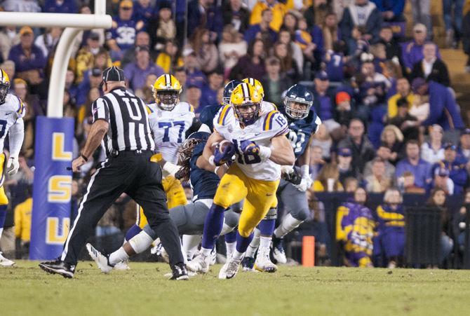 Foster Moreau runs the ball during the Tigers game against Rice in Tiger Stadium on Saturday, Nov. 17, 2018.