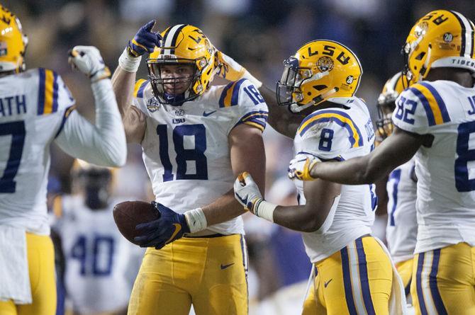 LSU senior tight end Foster Moreau (18) celebrates during LSU's 42-10 victory over Rice in Tiger Stadium on Saturday, Nov. 17, 2018.