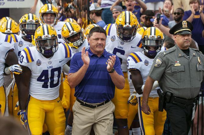 LSU head coach Ed Orgeron leads the team on to the field during the Tigers&#8217; 31-0 victory over Southeastern in Tiger Stadium on Saturday, Sept. 8, 2018.