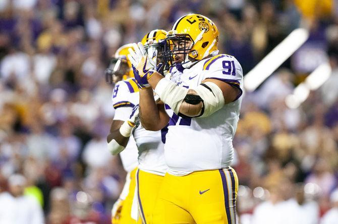 LSU junior defensive end Breiden Fehoko (91) claps after a play during the Tigers' 29-0 loss against Alabama on Saturday, Nov. 3, 2018, in Tiger Stadium.