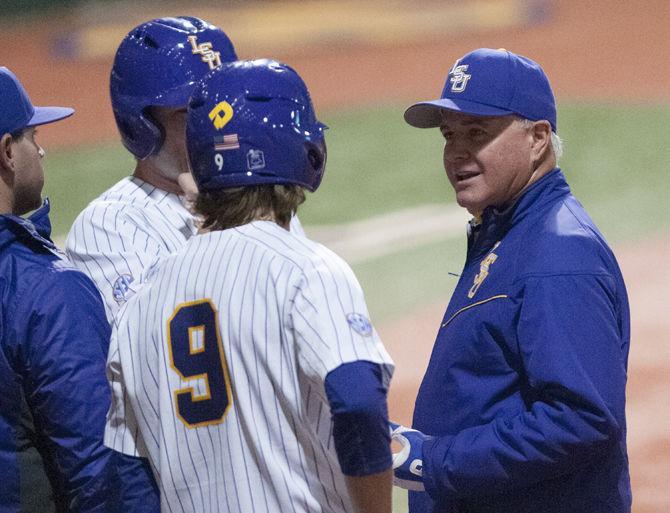 LSU coach Paul Mainieri talks to his players during the Tigers' 9-4 win against&#160;University of South Alabama on Wednesday March 14, 2018, at Alex Box Stadium.