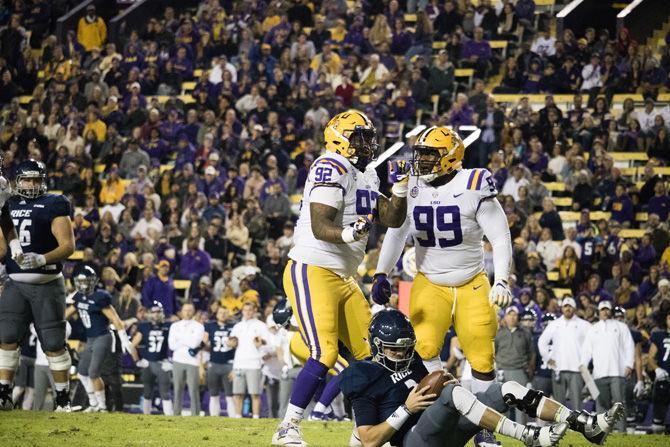 On Saturday, Nov. 17, 2018 LSU sophomore defensive end Neil Farrell Jr. (92) celebrates with junior nose tackle Ed Alexander during the Tigers' 42-10 victory against Rice.