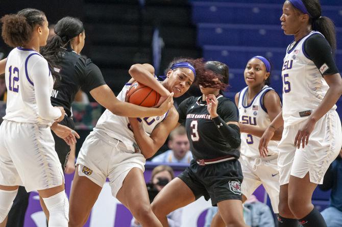 LSU junior forward Ayana Mitchell (5) fights for a ball during the lady Tigers' 76-52 loss to South Carolina, on Sunday, Jan. 13, 2019 in the PMAC.