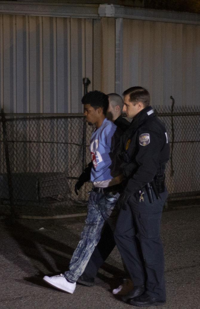 LSU Police escort Darrian Jones to jail in at the LSU police station on Wednesday, Jan. 30, 2019.