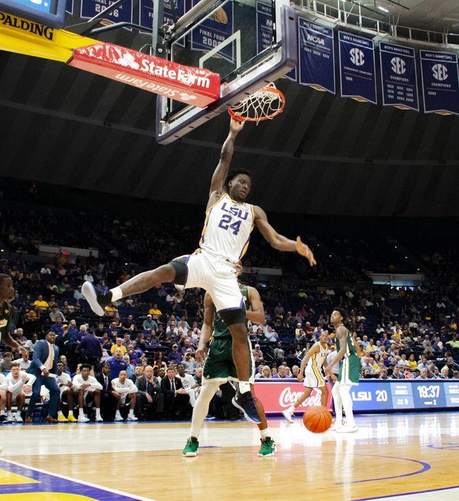 LSU forward Emmitt Williams (24) dunks the ball during the Tigers' 94-63 win against Southeatern on Tuesday, Nov. 6, 2018, in the PMAC.