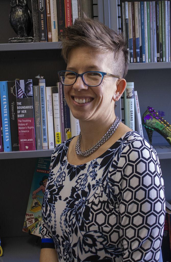 Dr. Catherine Jacquet sits in her office on the second floor of Himes Hall, on Tuesday, Jan. 8, 2019.