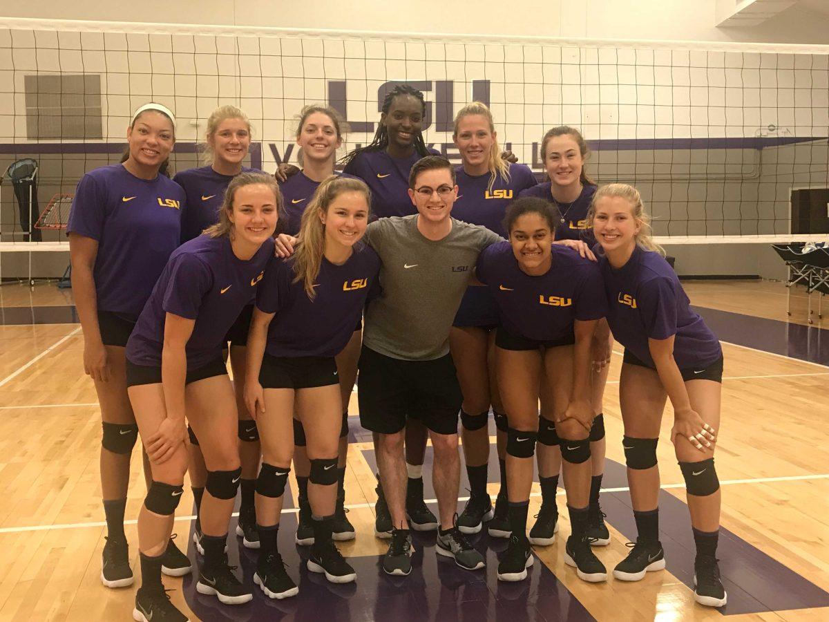 Kinesiology junior Jeremy Plante stands with the LSU Volleyball team, which he worked with during the 2017-18 season.