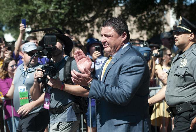 Coach Ed Orgeron marches down Victory Hill at Tiger Stadium on Saturday, Oct. 13, 2018.