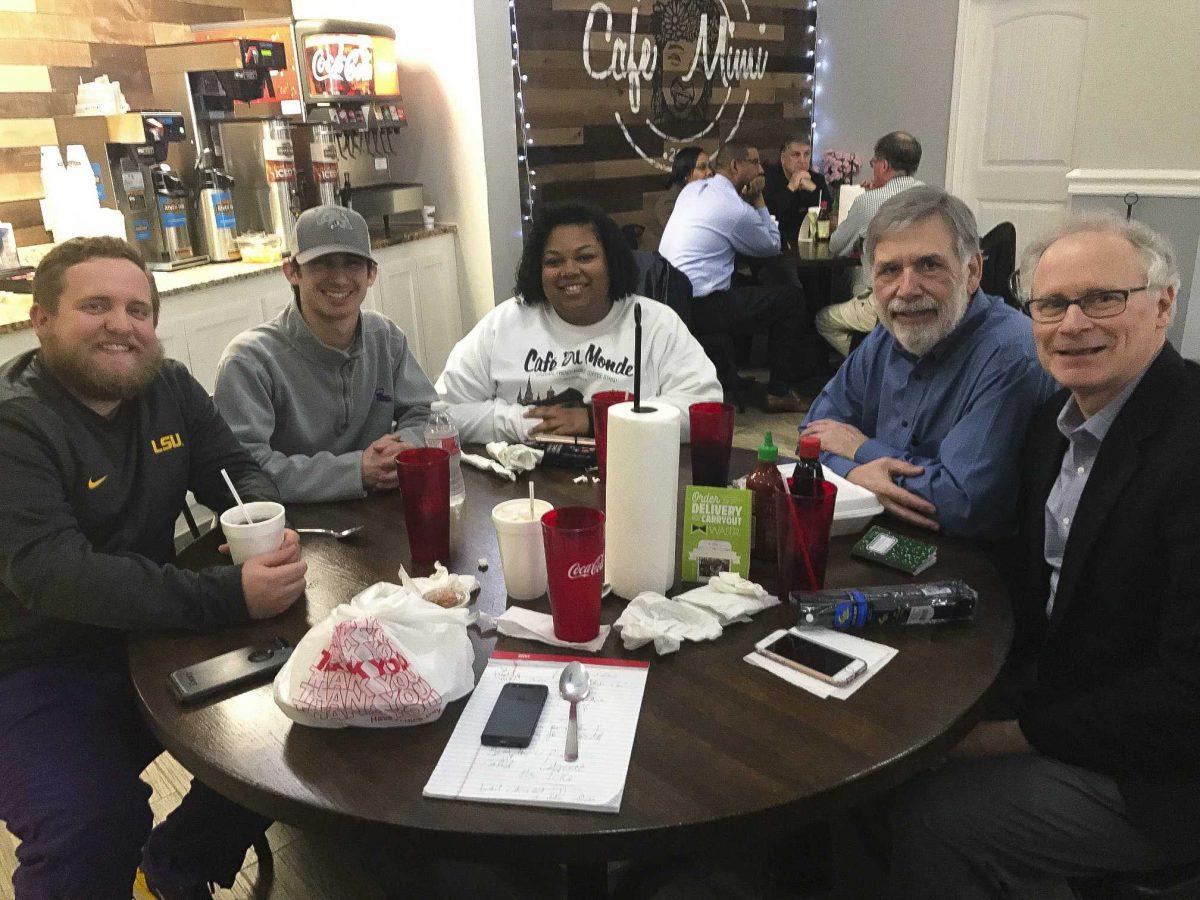 LSU mass communication seniors Jace Mallory (left), Brennan Normand and junior Alyssa Berry sit with author Stanley Nelson and Manship professor Chris Drew (right) to discuss the cold case project at Caf&#233; Mimi on Thursday, Jan. 17, 2019.