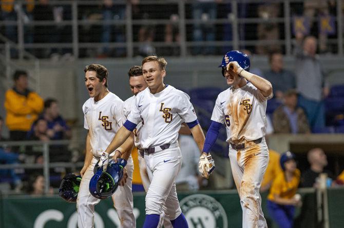 LSU senior outfielder Antoine Duplantis (8) celebrates a home run during the Tigers' 12-7 win against ULM on Friday, Feb. 15, 2019, at Alex Box Stadium.