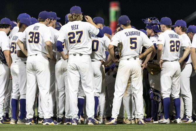 The LSU Tigers congratulate each other after LSU&#8217;s 9-3 victory over University of Tennessee in Alex Box Stadium on Friday, April 13, 2018.