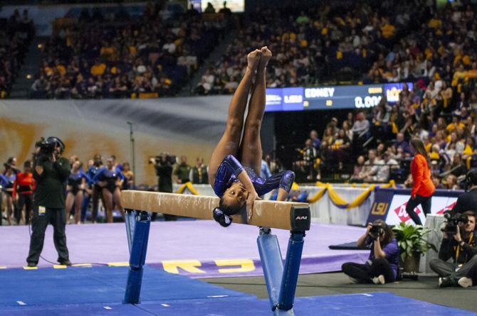 LSU&#160;all-around junior Kennedi Edney performs a routine on the bar during the Tigers' 197.500-197.425 loss to Florida on Friday, Jan. 18, 2019 in the PMAC.