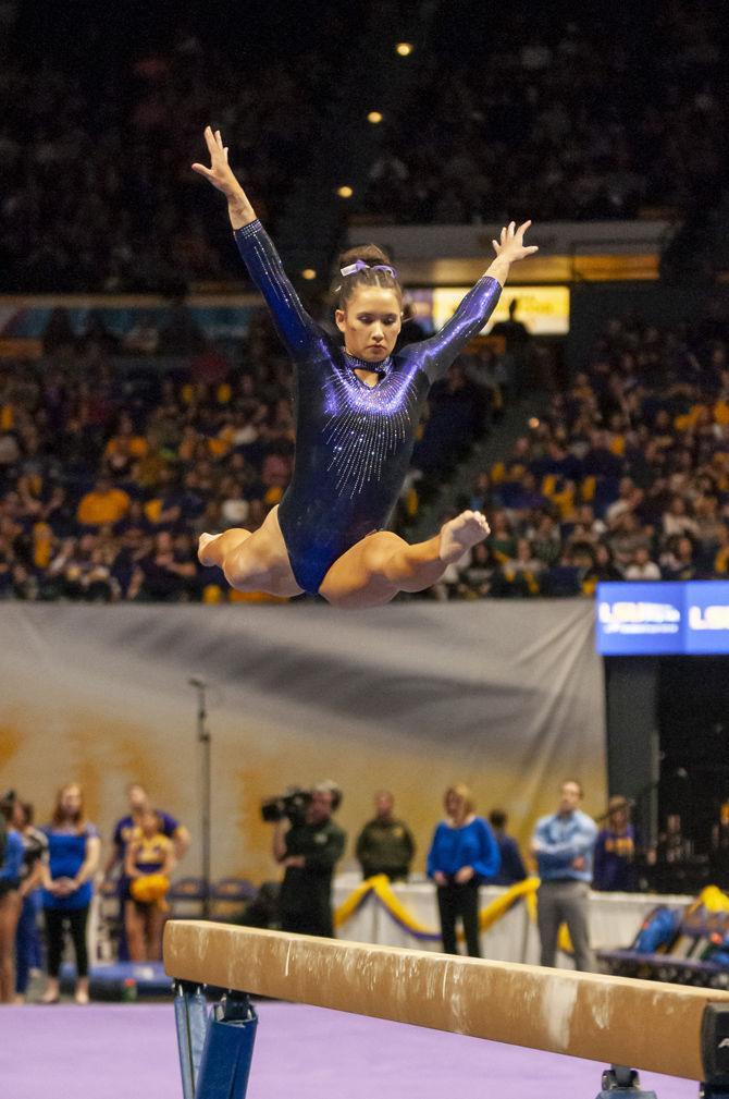 LSU&#160;all-around senior Sarah Finnegan performs on the high beam during the Tigers' 197.500-197.425 loss to Florida on Friday, Jan. 18, 2019 in the PMAC.