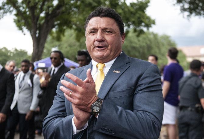 LSU coach Ed Orgeron walks down Victory Hill on Saturday, Sept. 22, 2018, before the game against LA Tech.