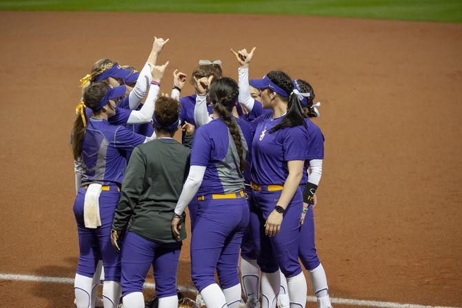 LSU softball players enter the field before the Lady Tigers' 19-1 victory over Tulsa, Thursday, Feb. 7, 2019, in Tiger Park.