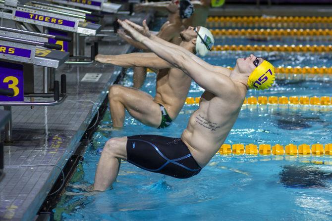 LSU senior Will Arthur swims the 100-yard backstroke event during the Tigers' victory in the LSU Natatorium, on Saturday, Jan. 12, 2019.