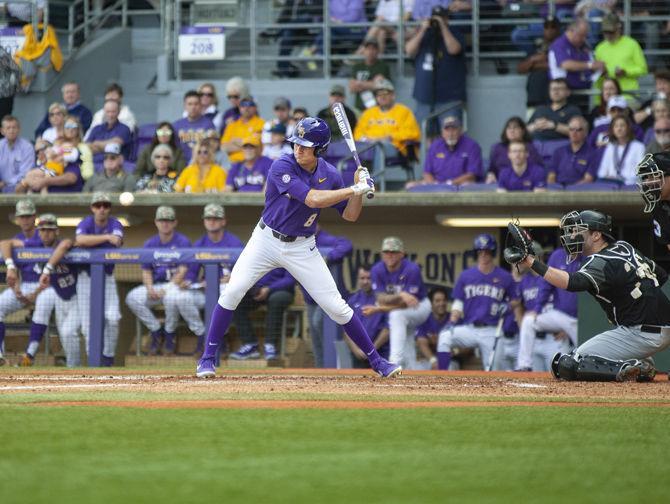 LSU senior right fielder Antoine Duplantis (8) swings at a pitch during the Tigers' 6-5 victory over Army on Saturday, Feb. 16, 2019, in Alex Box Stadium.