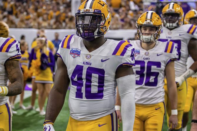 LSU junior linebacker Devin White (40) enters the field before the Playstation Fiesta Bowl on Tuesday, Jan. 1, 2019.