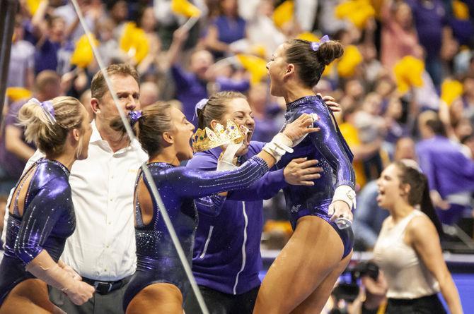 LSU&#160;all-around senior Sarah Finnegan celebrates after a routine on the bars during the Tigers' 197.500-197.425 loss to Florida on Friday, Jan. 18, 2019 in the PMAC.