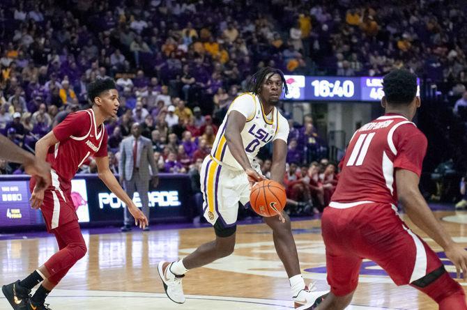 LSU freshman forward Naz Reid (0) passes the ball during the Tigers' 89-90 loss to Arkansas on Saturday, Feb. 2, 2019, in the PMAC.