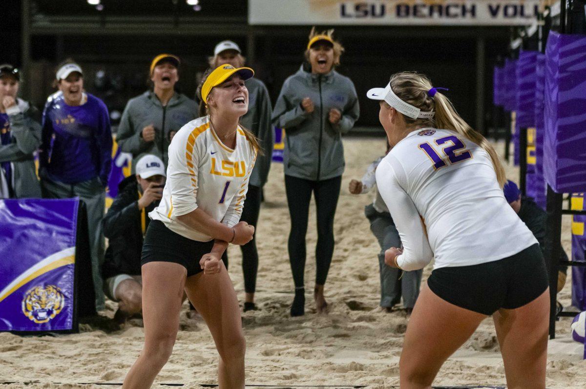 LSU freshman Kelli Agnew (1) celebrates after a play during the Tigers' 5-0 victory over Coastal Carolina on Friday, March 15, 2019, in the Beach Volleyball Facility.