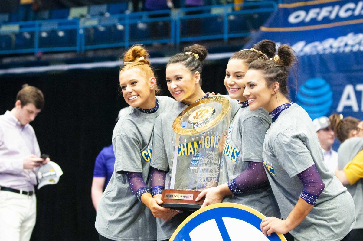 LSU Gymnastics seniors celebrate placing first during the SEC Championship meet on Saturday, March 23, 2019, in the Smoothie King Center.