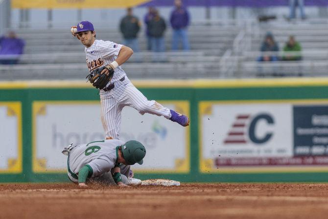 LSU junior infielder Josh Smith (4) throws to first base during the Tigers' 6-5 victory over Southeastern on Tuesday, Feb. 19, 2019, in Alex Box Stadium.