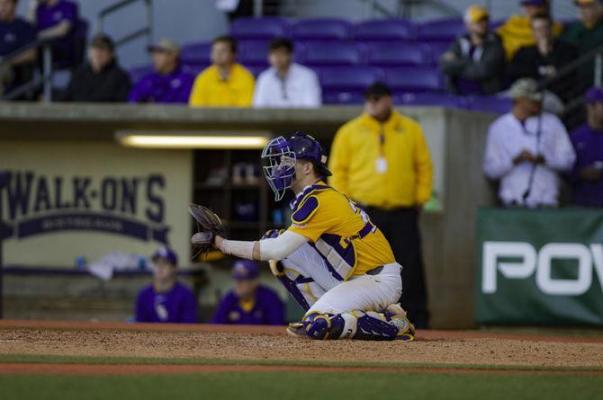 Sophomore catcher Brock Mathis awaits the pitch during LSU's 4-3 win over Bryant on Sunday, Feb. 24, 2019 in Alex Box Stadium.