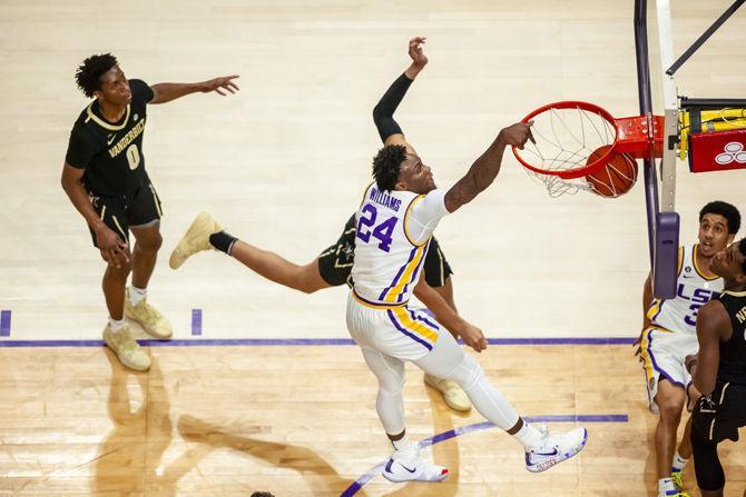 LSU freshman forward Emmitt Williams (24) dunks the ball during the Tigers' 80-59 victory over Vanderbilt on Saturday, March 9, 2019, in the PMAC.