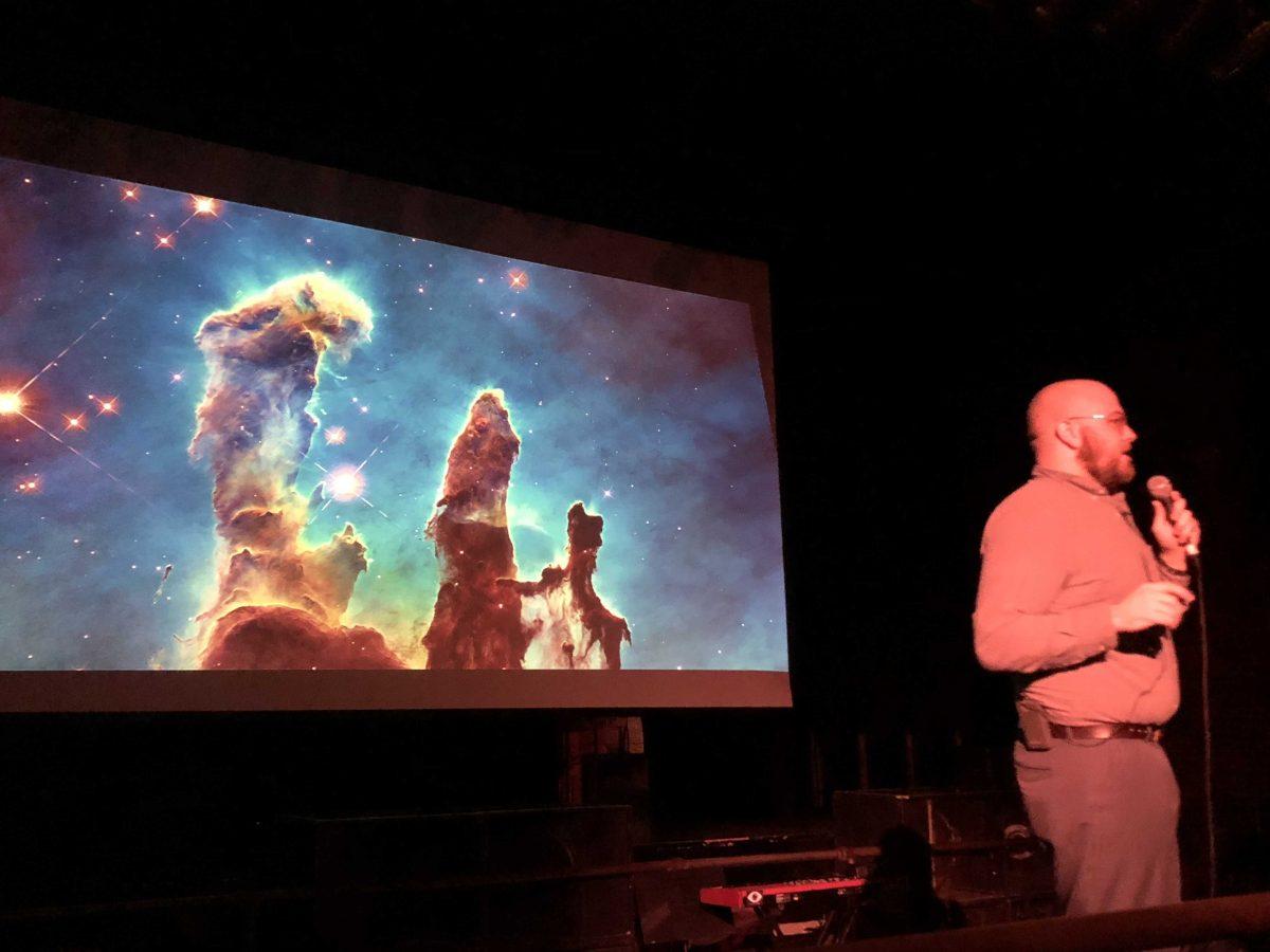 Geology and geophysics graduate student&#160;Connor Matherne gives a talk on astrophotography at the Astronomy on Tap event in the Varsity Theatre on Feb. 13.