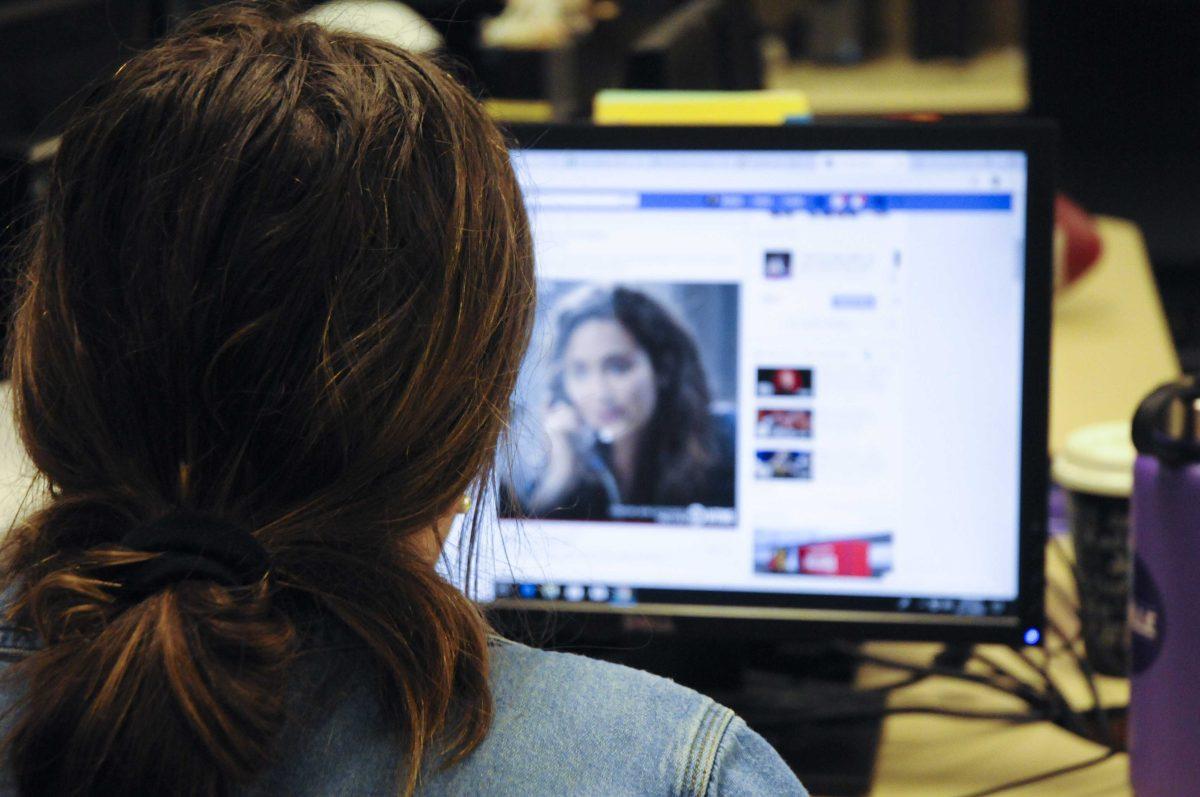 An LSU student scrolls through Facebook, on Monday, Feb. 11, 2019.