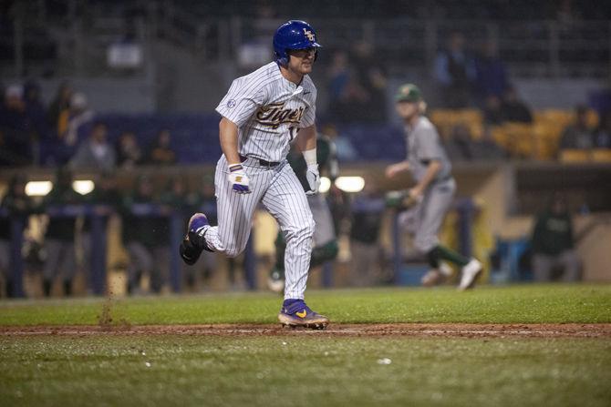 LSU senior infielder Chris Reid (17) runs to first during the Tigers' 6-5 victory over Southeastern on Tuesday, Feb. 19, 2019, in Alex Box Stadium.