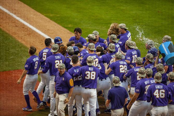 LSU baseball players celebrate after the Tigers' 6-5 victory over Army on Saturday, Feb. 16, 2019, in Alex Box Stadium.