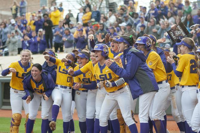 LSU softball celebrates after a homerun during the Tigers&#8217; 8-0 win over the Florida Gators on Sunday, March 17, 2019, at Tiger Park.