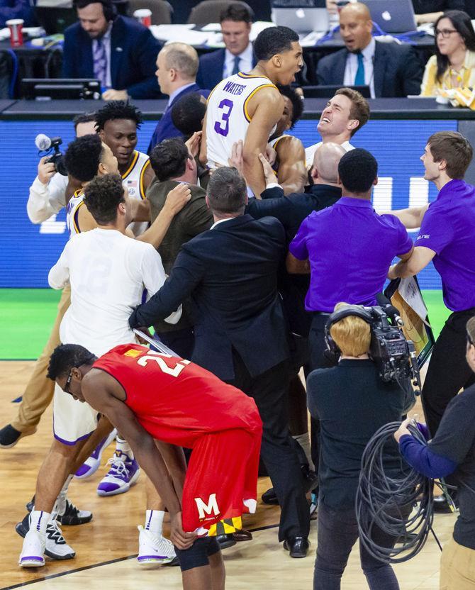 The LSU basketball team celebrates after the Tigers' 69-67 victory over Maryland on Saturday, March 23, 2019, in the Jacksonville Veterans Memorial Arena.