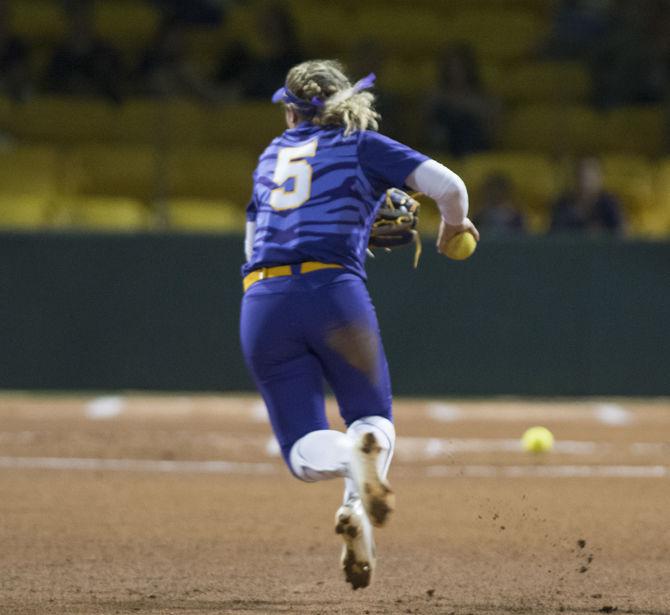 <p>LSU freshman utility player Kara Goff (5) warms up before the Tigers' 3-2 win over Oregon State on Saturday, Feb. 17, 2018, in Tiger Park.</p>